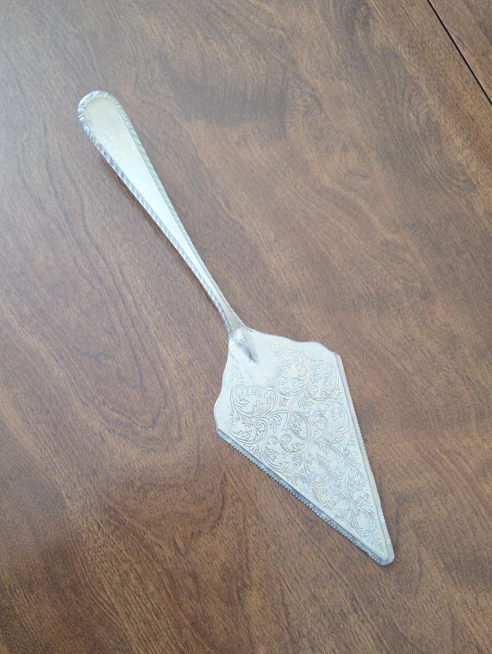 Ornate Silver Cake Server with Engraved Pattern